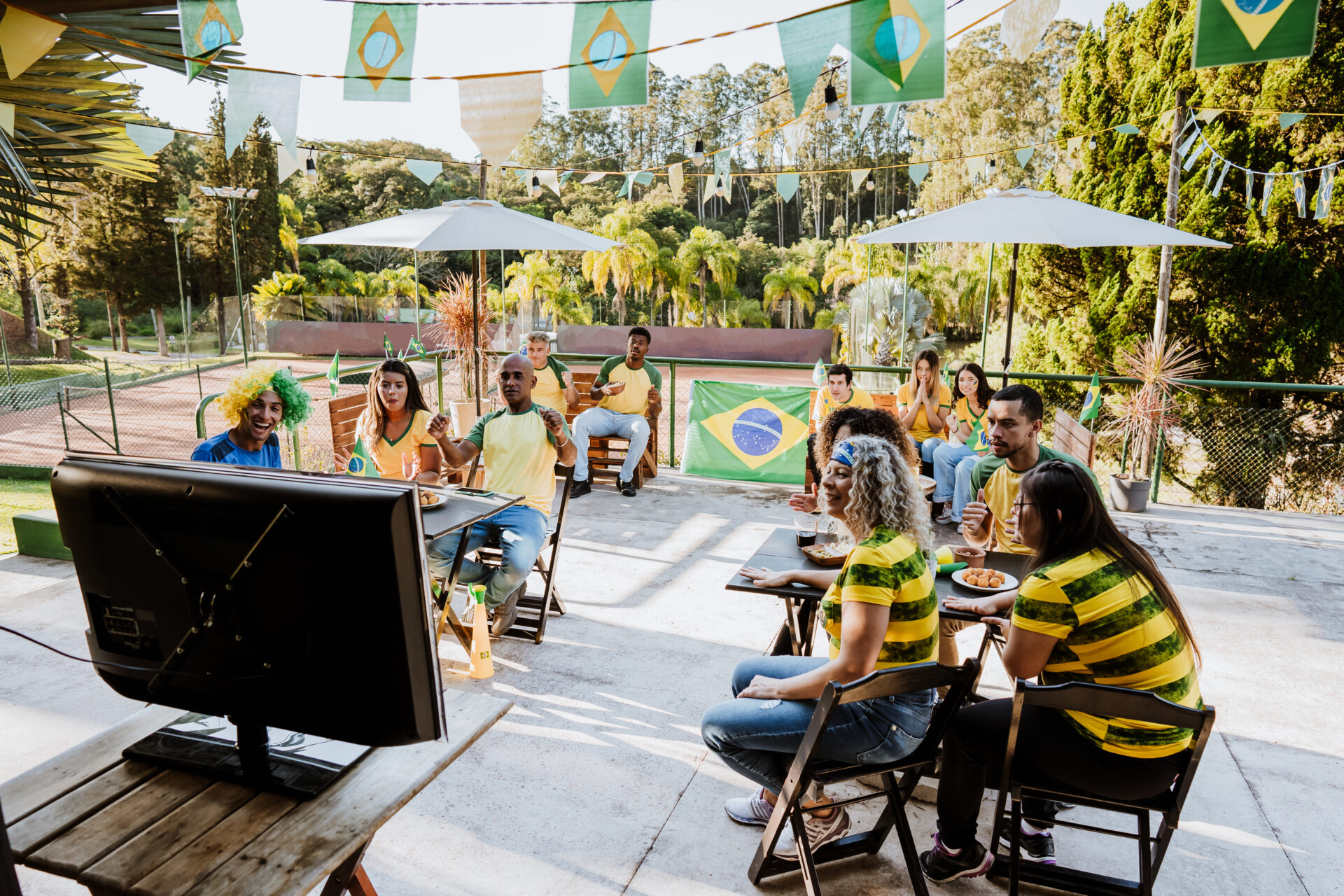 Happy Brazilian fans celebrating goal